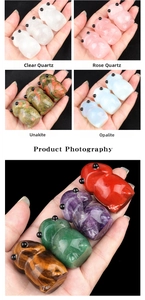 Detailed view of hand-carved hippo figurines made from polished natural crystal and quartz