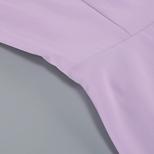 Macro shot of lavender purple A-line dress showing twill fabric texture and sewing details