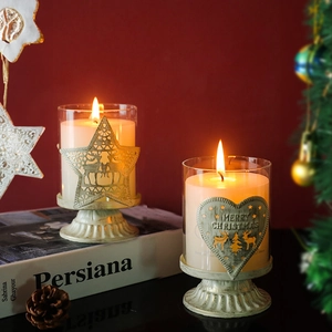Christmas candle holder set with reindeer and star metal decor on a white base
