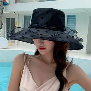 Women's black polka dot wide brim sun hat with mesh lace details for summer beach travel