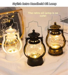 Macro detail of vintage LED lanterns in white, black, and bronze with warm fairy lights