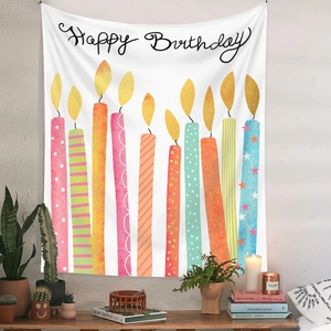 Detail of Happy Birthday wall tapestry with colorful cartoon candles and natural lighting