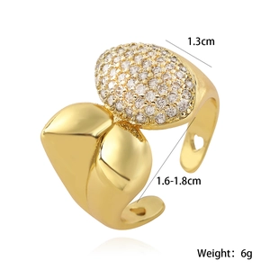 Macro detail of 18K gold-plated irregular ring with pavé stones and heart cutout