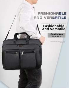 Detail view of water-resistant black oxford fabric and front zipper pockets on business bag