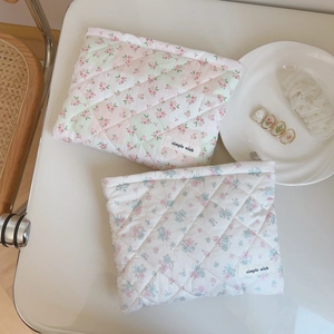 Pink floral quilted cotton cosmetic pouch and storage bag with quilted diamond pattern
