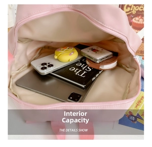 Detailed interior view of a pink school bag with large capacity for tablets and books