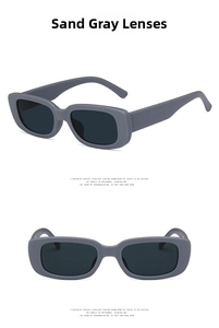 Detail view of matte sand gray rectangular sunglasses with dark gray lenses