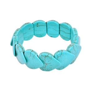 Bohemian turquoise beaded stretch bracelet with vintage heart charms on white background