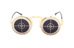 Detail of steampunk flip-up sunglasses with gold metal round frame and crosshair lens