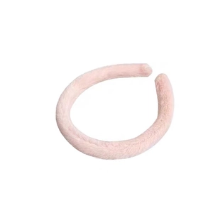 Pink plush headband for women with soft faux fur texture for skincare and daily wear