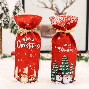 Christmas wine bottle covers with Santa and snowman prints featuring gold ribbons