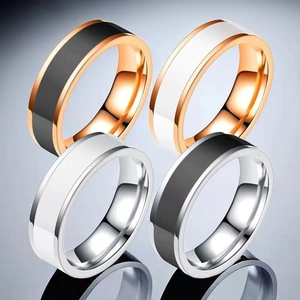 Polished stainless steel rings in rose gold and silver finish with black and white inlays