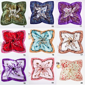 Nine different patterns of satin silk scarves featuring floral and chain link prints
