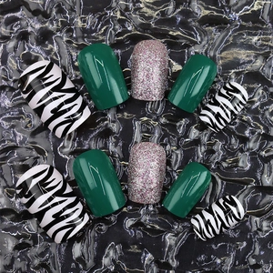 Green zebra print and purple glitter press-on nails set with glossy finish