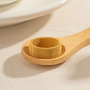 Minimalist 18K gold plated stainless steel 8mm wide mesh ring on beige linen