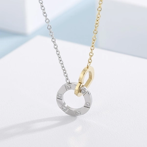 Titanium steel interlocking rings necklace with diamond accents and gold-silver dual tones