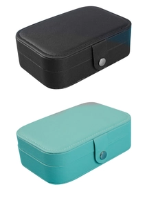Detail of portable PU leather jewelry boxes in black and mint green with snap closure