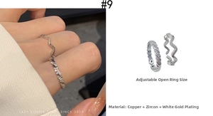 Detail of adjustable zircon wave and twisted rope ring set in white gold plating