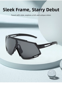 Close-up of all-black cycling sunglasses with geometric hollow temples on a blue stand