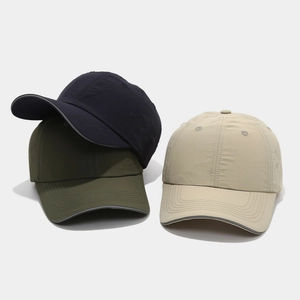Flat lay of quick-dry nylon baseball caps in navy blue, army green and khaki colors