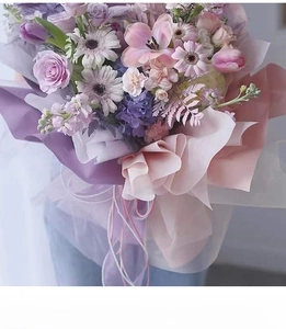 Detail of bouquet wrap featuring pearl beads chain and soft pink ribbon accent