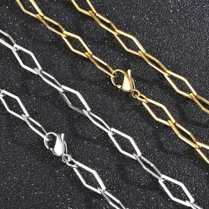 Close-up of gold and silver geometric hollowed diamond chains with lobster clasps