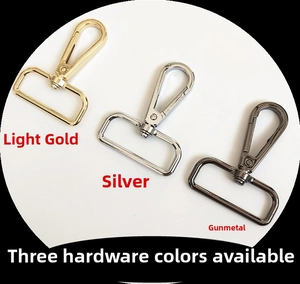 Close-up of swivel lobster clasps in gold, silver, and gunmetal finishes for bag straps