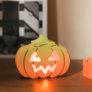 Close-up of a hollow pumpkin silicone resin mold with warm orange light effect