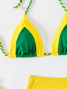 Detail of yellow and green bikini with textured fabric and braided spiral straps