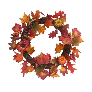 Autumn wreath with maple leaves, pumpkins, and berries for Thanksgiving door decoration