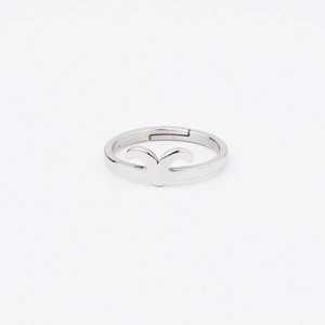 Detailed macro view of silver mirror-finish stainless steel open ring with horn motif