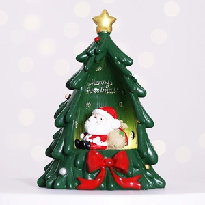 Resin Santa Claus Christmas tree ornament with Merry Christmas text on bokeh background