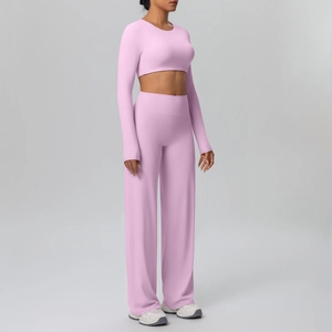 Detail of pink yoga set with thumb holes on long sleeves and high waist trousers