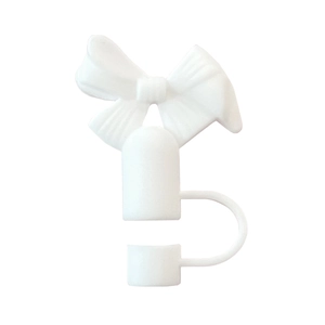 Détail macro du capuchon de paille blanc en silicone en forme de nœud pour 10mm tasses
