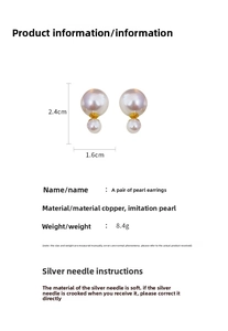 Detail view of pearl stud earrings with size measurements 2.4cm by 1.6cm on white background
