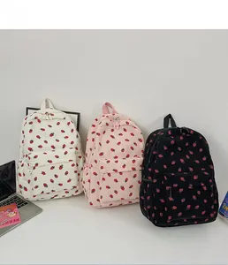 Three colors of corduroy strawberry backpacks with cute floral patterns for school