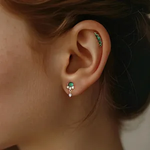 Elegant gold S925 silver stud earring and cuff set with green emerald zircon accents