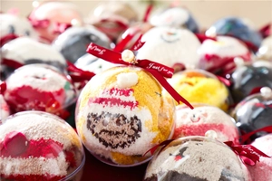 Detailed view of Christmas coral fleece socks in transparent ball gift boxes