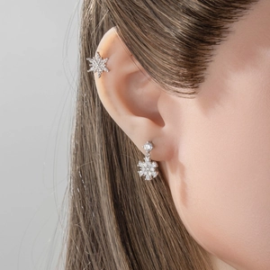 Silver snowflake zircon cartilage stud earring and ear cuff set worn by model