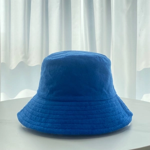 Detailed close-up of blue terry cloth fabric texture on a seasonal bucket hat