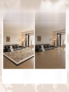 Detail of floral rug with black geometric borders showing living room contrast