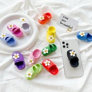 Miniature sandal phone grip stand with sunflower charms in various vibrant colors