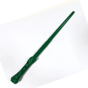 Detailed close-up of a green wizard wand with LED lighting feature for cosplay costumes