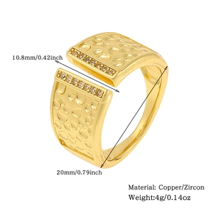 Detail of gold-plated open ring with hammered texture, zircons and size specifications