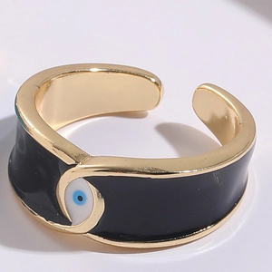 Macro shot of 14K gold-plated Evil Eye open ring with black and blue enamel detailing