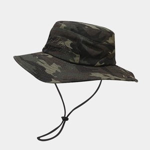 Close-up of mountain embroidery and mesh eyelets on camouflage outdoor boonie hat