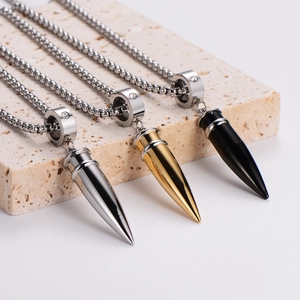 Bullet pendant necklaces in silver, gold, and black steel with crystal accents