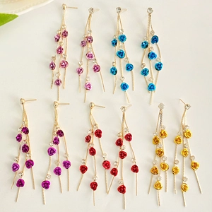 Long rose flower tassel earrings with rhinestones in five colors on white background