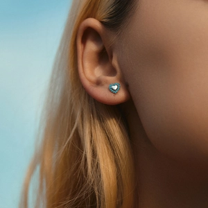 Elegant S925 sterling silver heart stud earrings featuring turquoise stone accents