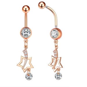 Macro shot of rose gold navel ring featuring a zircon-studded hollow star pendant